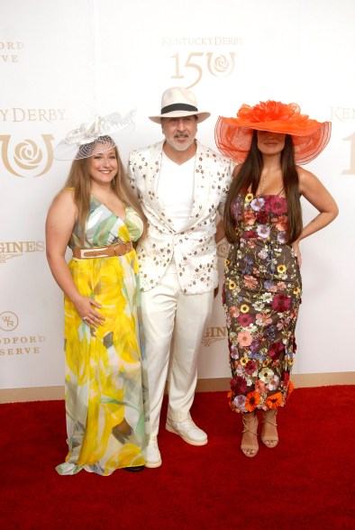 Joey Fatone, center, poses with his daughter, Briahna, left, and his date, Izabel Araujo, right, on the 150th Kentucky Derby