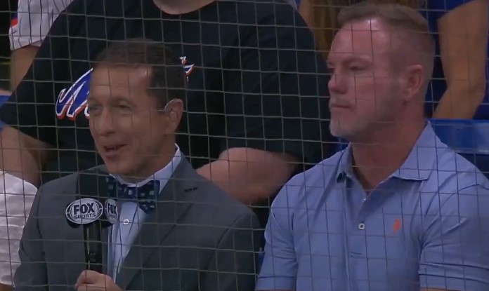 Christian Scott's dad, Doug, (right) does an interview with Fox Sports Ken Rosenthal.