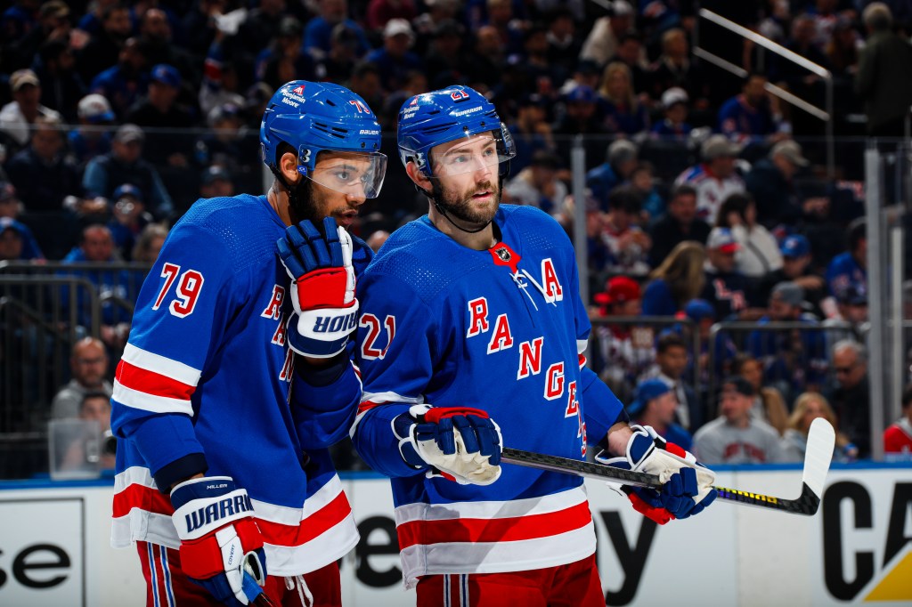 K'Andre Miller (L.) looks on during the Rangers' Game 1 win over the Hurricanes on May 5, 2024.