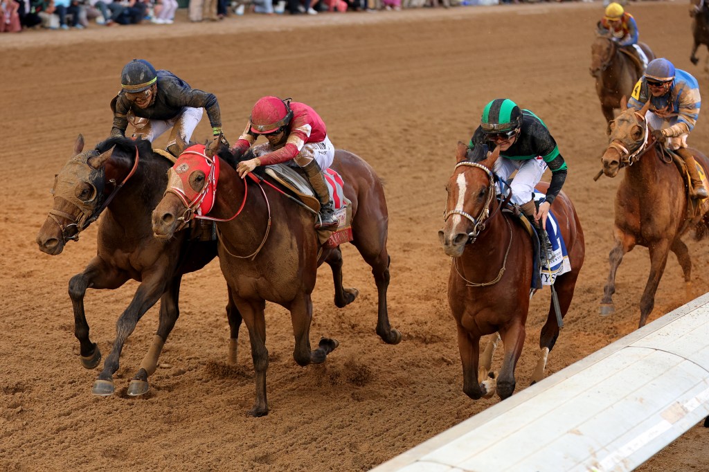 Mystik Dan #3, ridden by jockey Brian J. Hernandez Jr. crosses the finish line ahead of Sierra Leone.