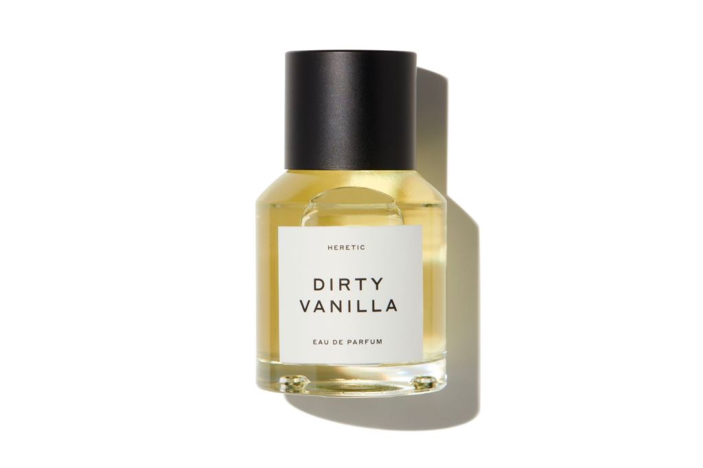 Best Vanilla Perfumes - a bottle of perfume with a black cap