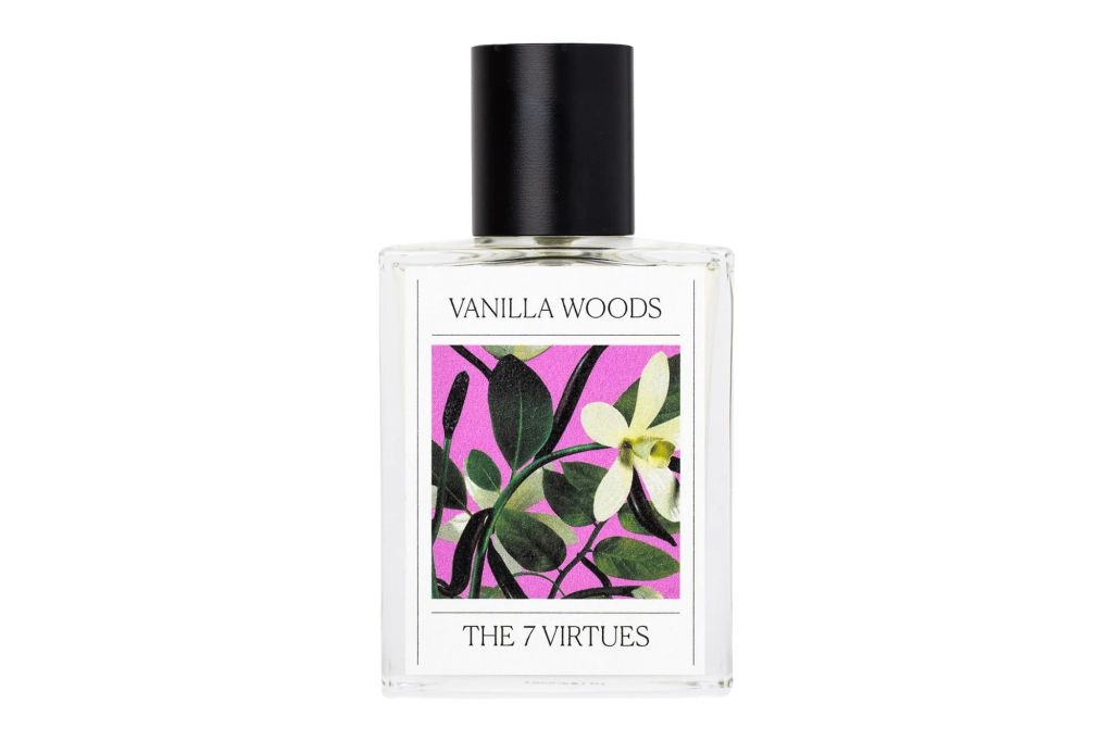 A bottle of vanilla perfume with a printed flower on the bottle