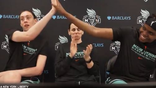 Liberty star Breanna Stewart (l.) high-fives teammate Jonquel Jones over the news the WNBA will be chartering flights for all teams this season. 