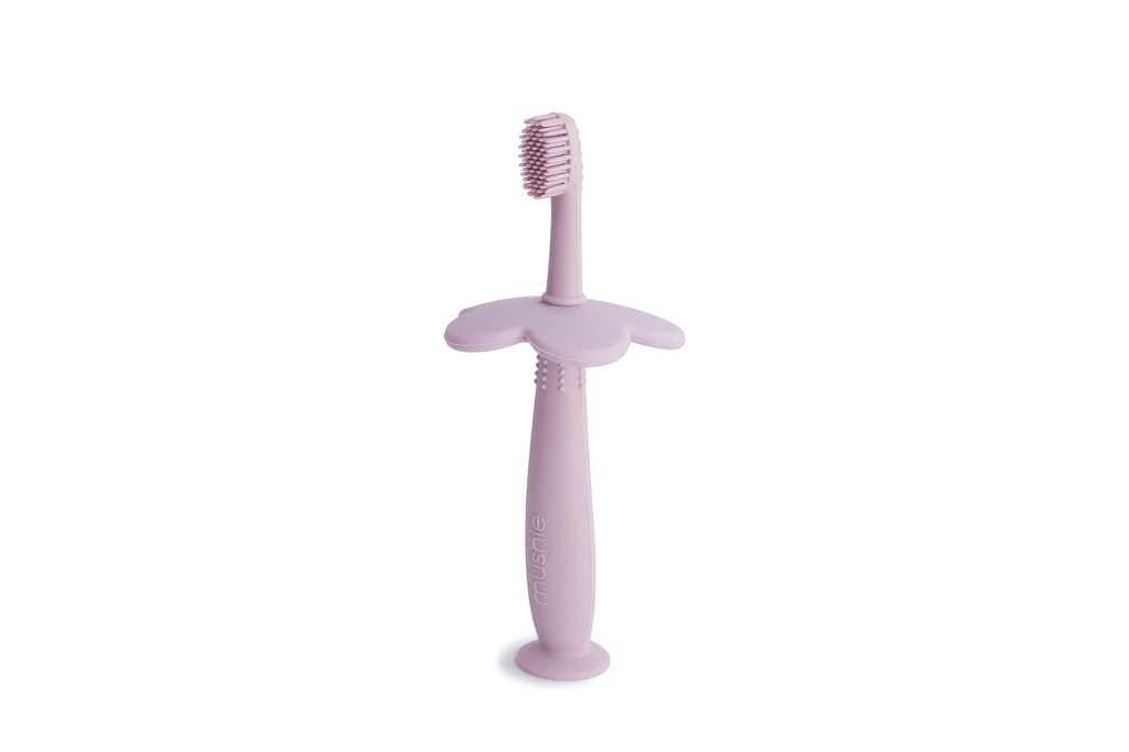 A pink toothbrush with a handle