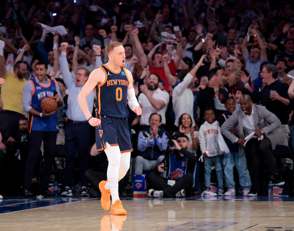 New York Knicks guard Donte DiVincenzo #0 reacts after hitting a shot during the third quarter.