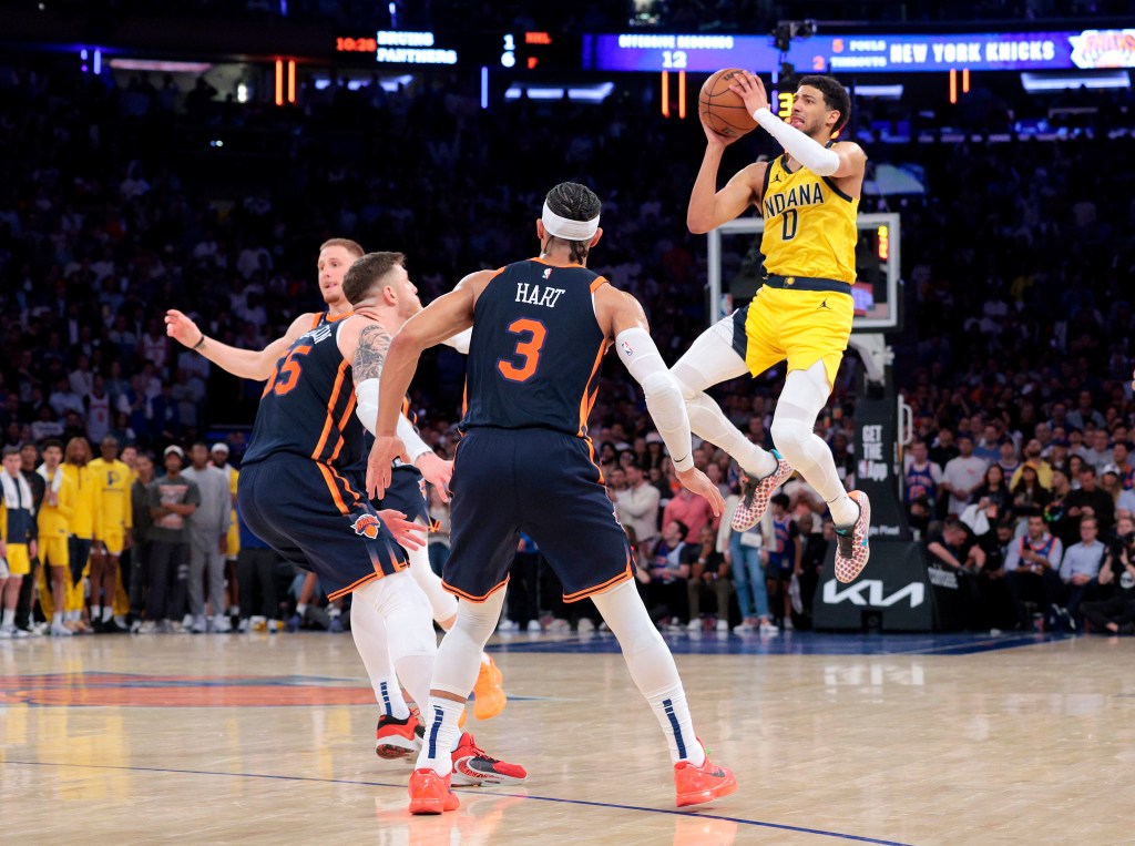 Tyrese Haliburton puts up a jumper over Isaiah Hartenstein (left) and Josh Hart during the Knicks' Game 2 victory.