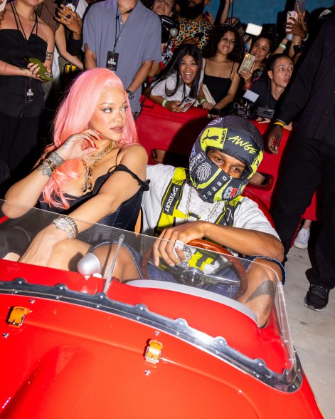 DEVIL MAY CAR: In Miami for the Grand Prix, A$AP Rocky gets behind the wheel while his partner, Rihanna, acts as his passenger princess.