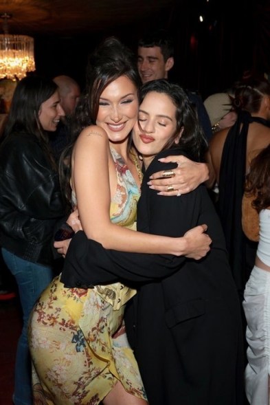 PLEASE HOLD: Bella Hadid (left) welcomes pal Rosalía to the launch event for her perfume brand.