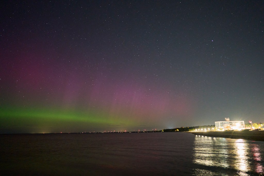 The Northern lights or aurora borealis illuminate the night sky in Grand Bend, Ontario, Canada, during a geomagnetic storm on May 12, 2024. 