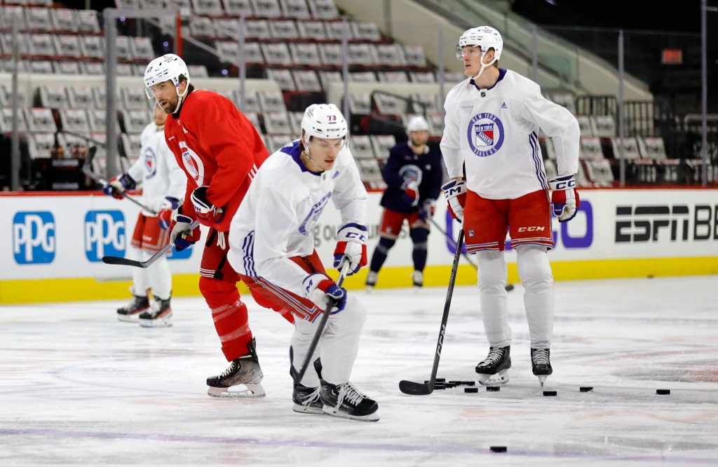 angers Matt Rempe (C), Blake Wheeler (L) and Adam Edstrom practices with their teammates