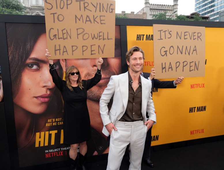 SIGN LANGUAGE: At the Austin, Texas, premiere of his film “Hit Man,” Glen Powell’s parents prank their son with cardboard.