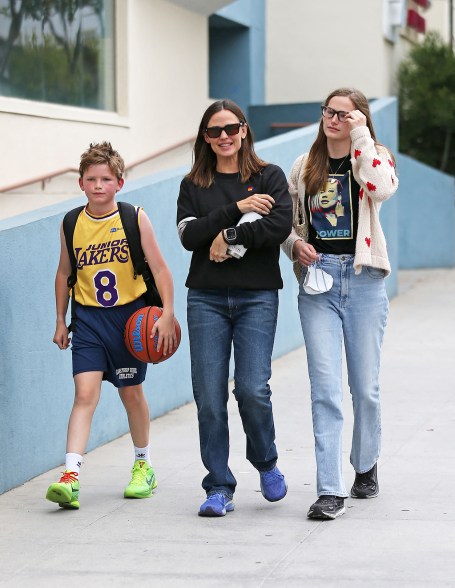 HOME TEAM: Jennifer Garner (center) and daughter Violet, 18, are ready to cheer on son and brother Samuel, 12.