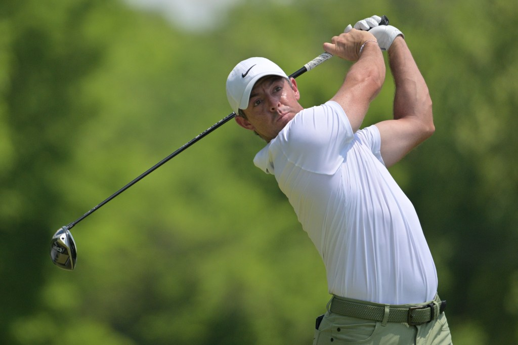 Rory McIlroy, of Northern Ireland, watches his tee shot on the fifth hole during the final round of the PGA Championship.