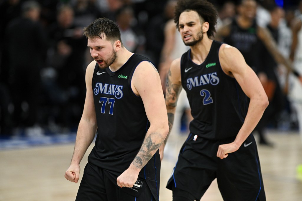 Luka Doncic #77 and Dereck Lively II #2 of the Dallas Mavericks celebrate after defeating the Minnesota Timberwolves in Game Two of the Western Conference Finals