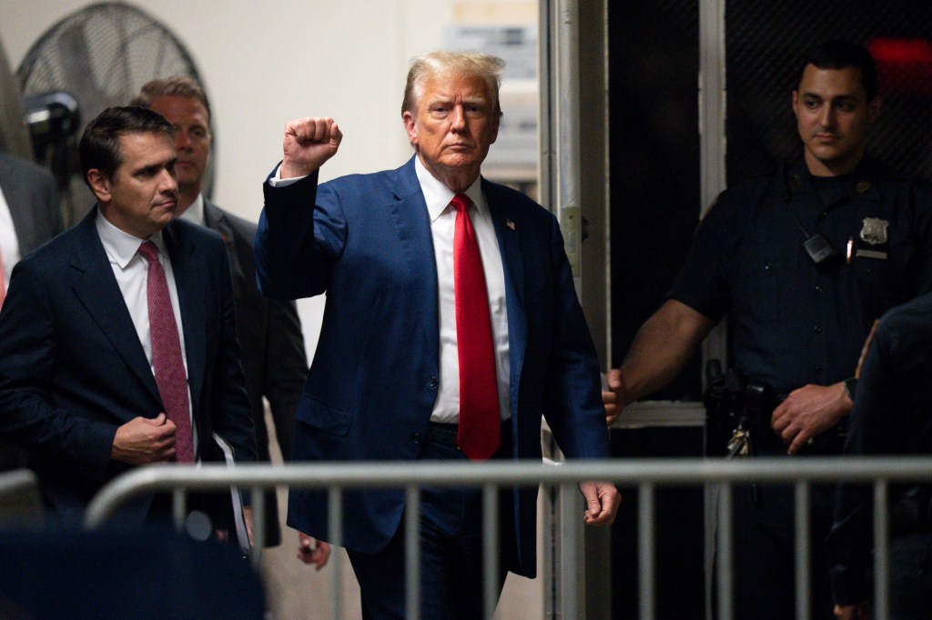 Former US President Donald Trump gestures as returns from a break in his trial for allegedly covering up hush money payments linked to extramarital affairs.