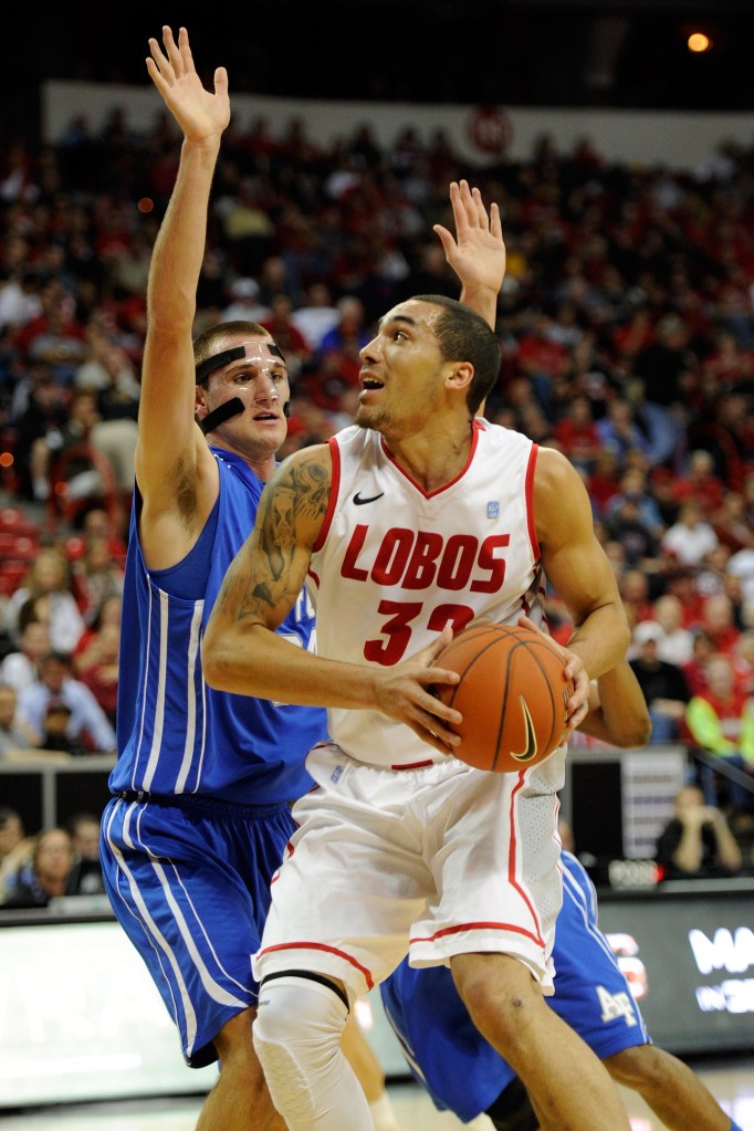 Drew Gordon #32 of the New Mexico Lobos drives against Taylor Broekhuis #34 of the Air Force Falcons during a quarterfinal game of the Conoco Mountain West Conference Basketball tournament at the Thomas & Mack Center March 8, 2012 in Las Vegas, Nevada