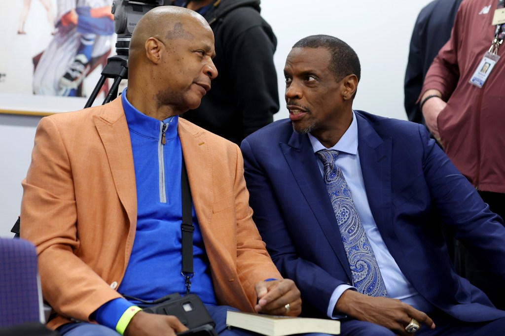 Darryl Strawberry (left) speaks with Doc Gooden ahead of Gooden's number being retired this past April. 