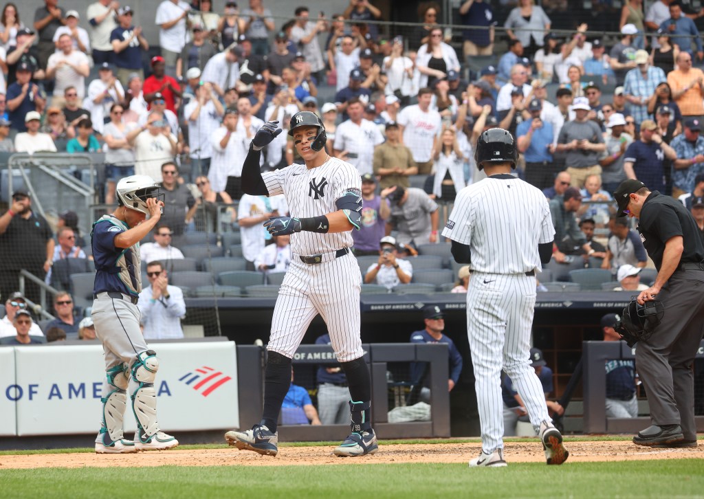 Aaron Judge reacts after he scores on his solo home run during the third inning against the Mariners.