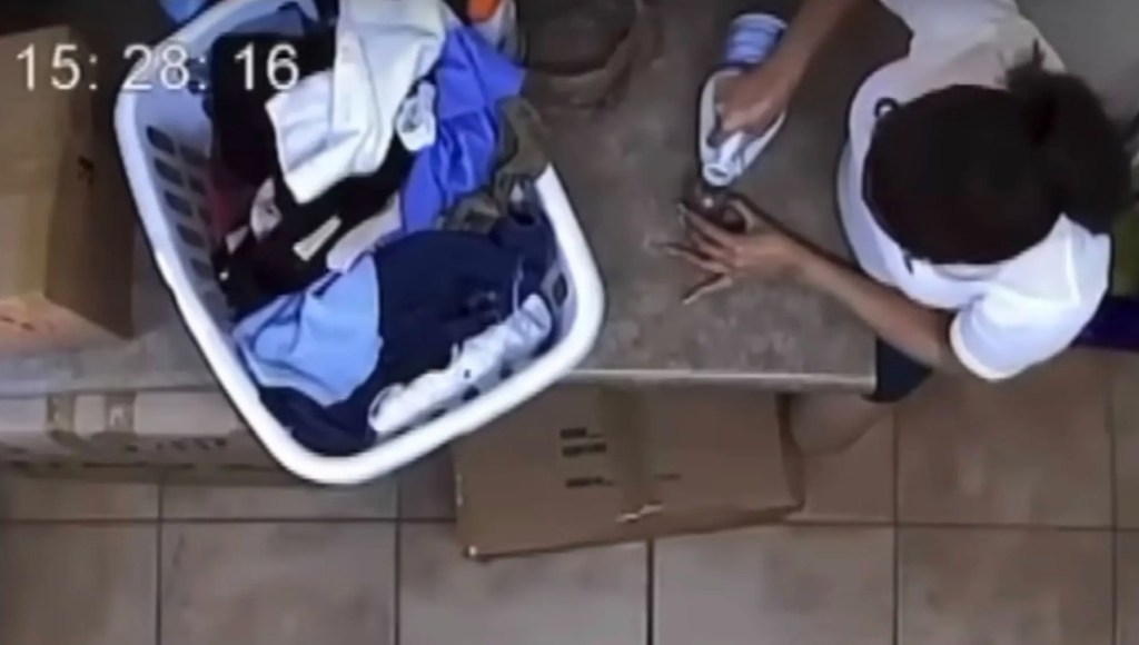 Johnson is seen in the family’s laundry room pouring bleach into a small container.