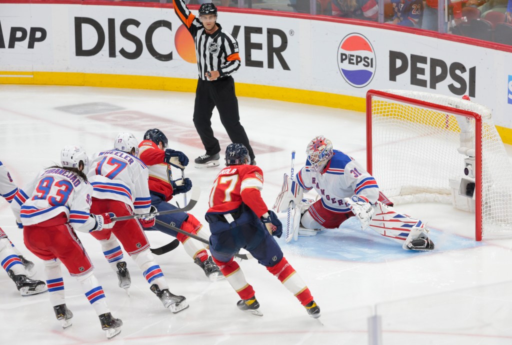 Blake Wheeler (No. 17) is called for hooking on Aleksander Barkov during overtime of the Rangers' 3-2 Game 4 loss to the Panthers. Florida scored the game-winning power-play goal soon after the Wheeler penalty.