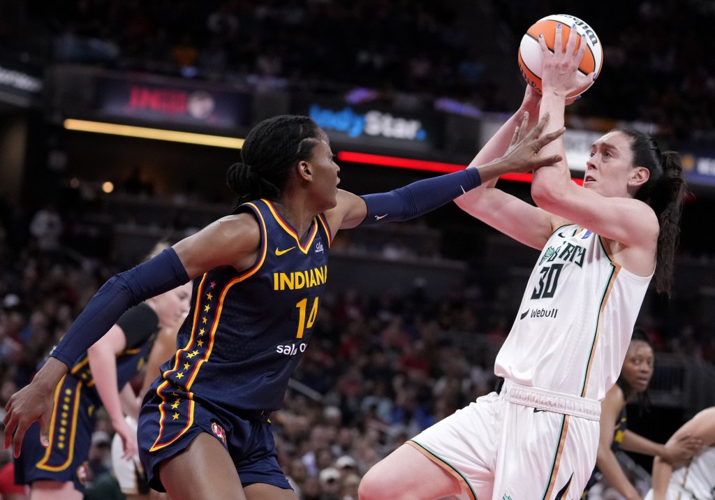 Breanna Stewart, who scored 31 points, shoots over Temi Fagbenle during the Liberty's 102-66 blowout win over the Fever.