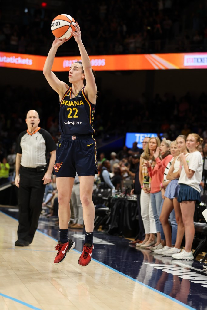 Caitlin Clark #22 of the Indiana Fever shoots a three point basket against the Dallas Wings during the first quarter in the preseason game at College Park Center on May 03, 2024 in Arlington, Texas.  