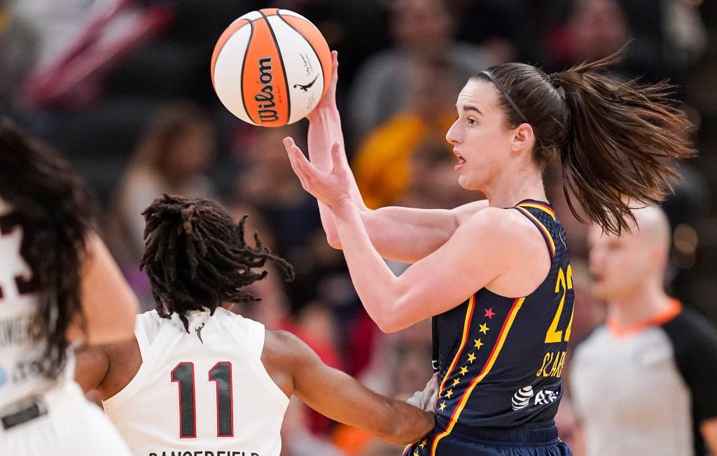 Caitlin Clark, who scored 12 points, makes a pass during the Fever's 83-80 preseason win over the Dream.