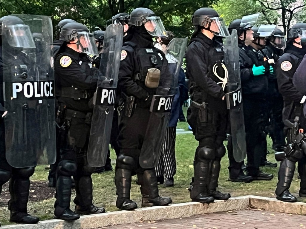 The officers, wearing tactical gear, gave the protesters a 2-minute warning around 6 a.m. to leave the capmus, according to reports.