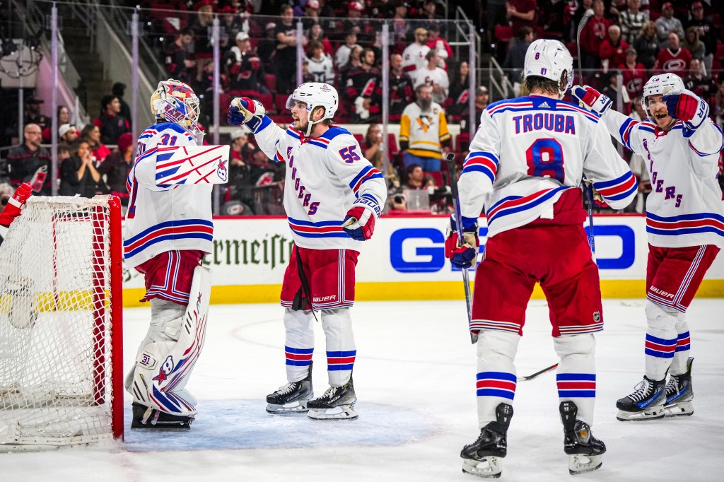 Igor Shesterkin #31 of the New York Rangers celebrates with teammates after a 5-3 victory in Game 6.