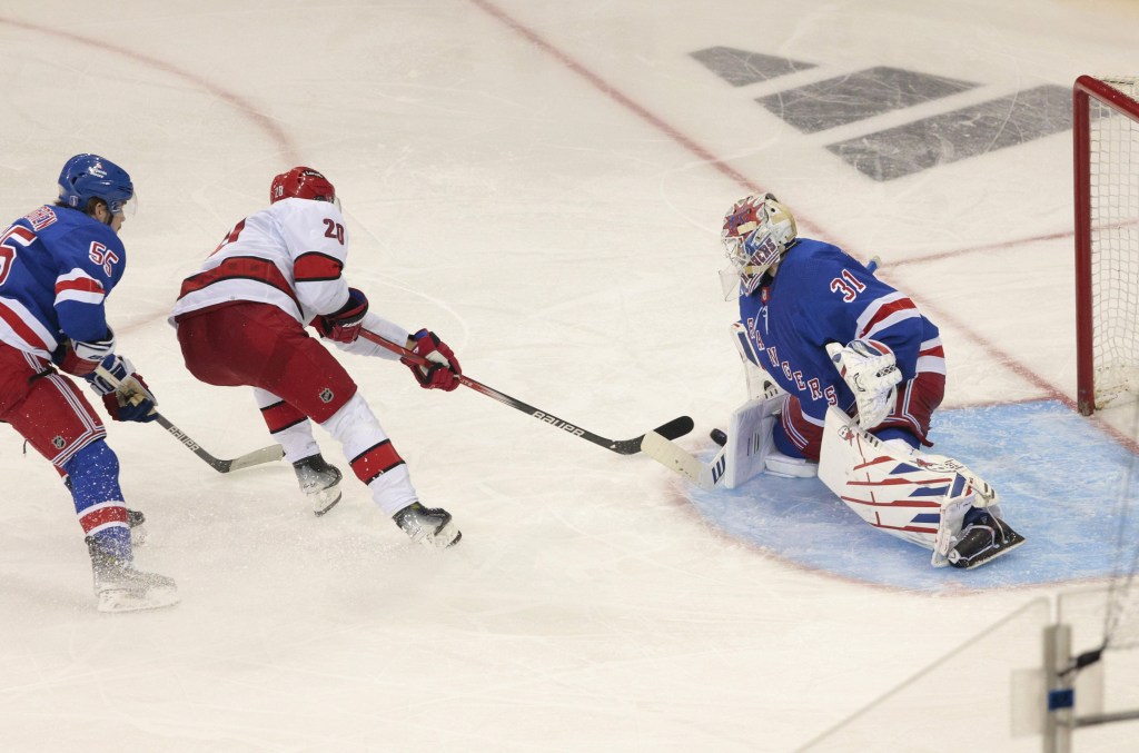 Igor Shesterkin makes a save on Sebastian Aho in the first overtime in the Rangers' 4-3 double OT victory over the Hurricanes in Game 2.