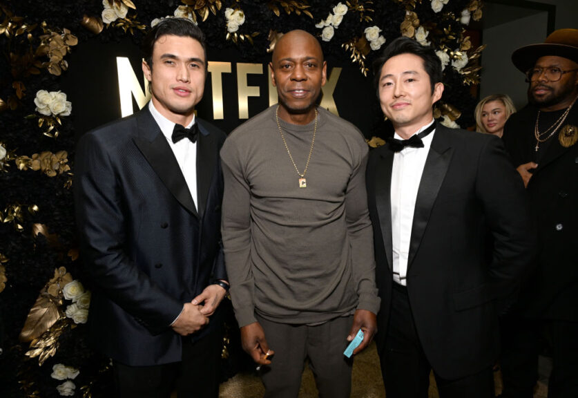 BEVERLY HILLS, CALIFORNIA - JANUARY 07: (L-R) Charles Melton, Dave Chappelle, and Steven Yeun attend Netflix's 2024 Golden Globe After Party at Spago on January 07, 2024 in Beverly Hills, California. (Photo by Michael Kovac/Getty Images for Netflix)