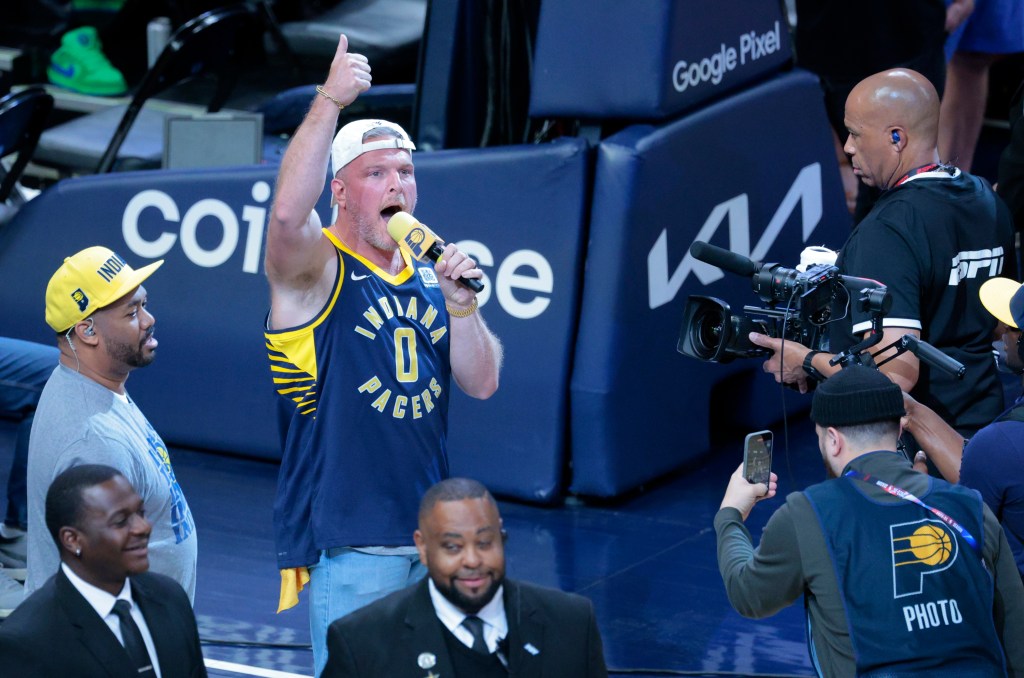 Sports analyst and Pacers fan Pat McAfee speaking to the fans during a timeout.