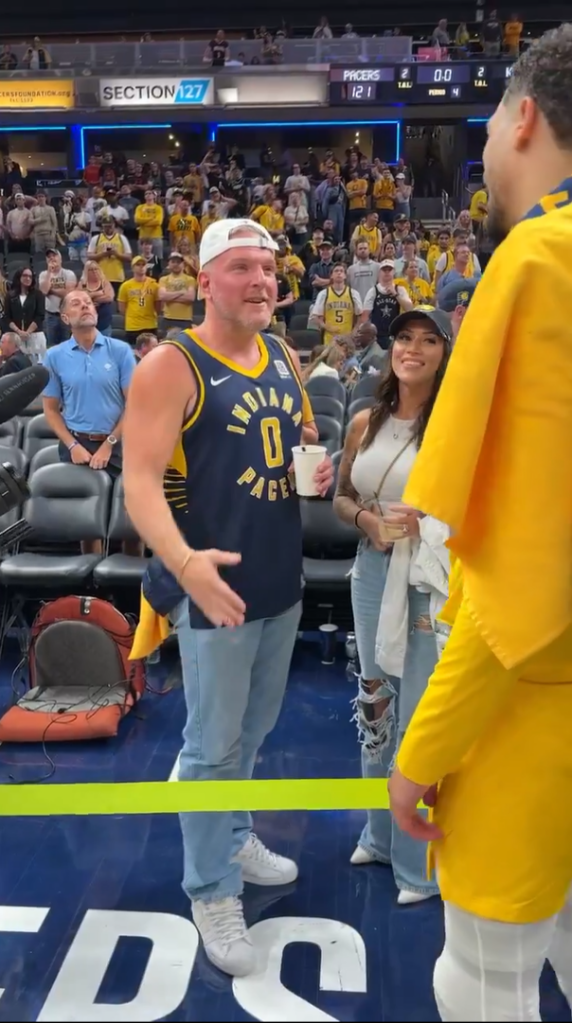 Pat McAfee and his wife, Samantha, speak with Tyrese Haliburton after the Pacers huge defeat of the Knicks in Game 4.