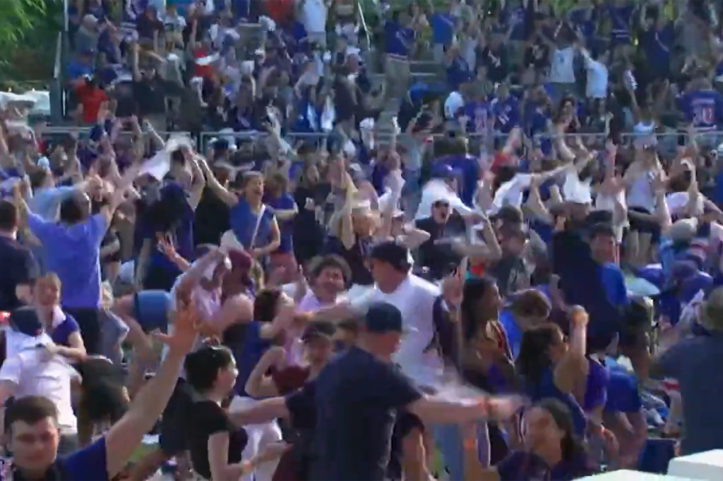 Rangers fans celebrate the overtime goal Sunday while in Central Park.