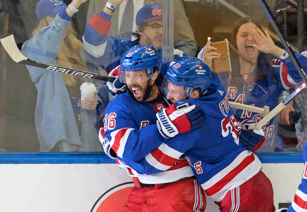 Vincent Trocheck #16, celebrates with his teammates after scoring a game winning goal in the 2nd Overtime as the Rangers beat Carolina 4-3.