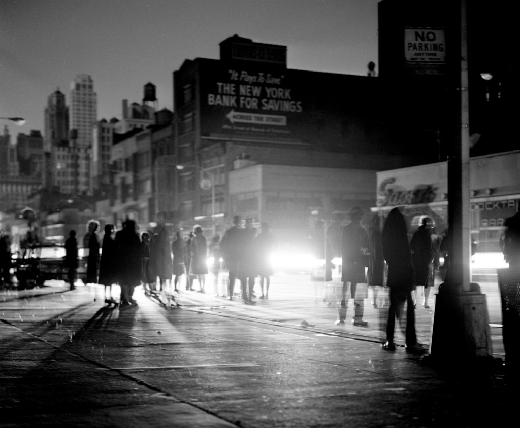 Group of people walking on 6th Avenue and 49th Street during the New York City blackout, Northeast blackout of 1965