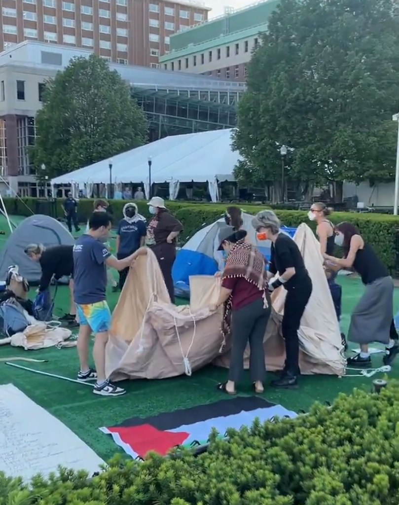 students setting up tents