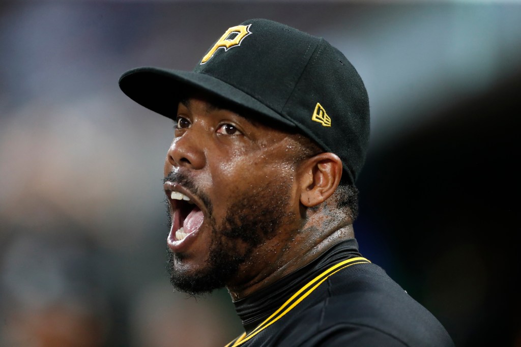 Aroldis Chapman celebrates after getting out of an eighth-inning jam in the Pirates' win. 