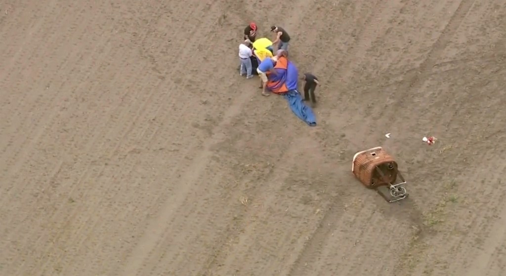 People gathering near crashed balloon on Monday, June 3, 2024 in Lowell, Ind.