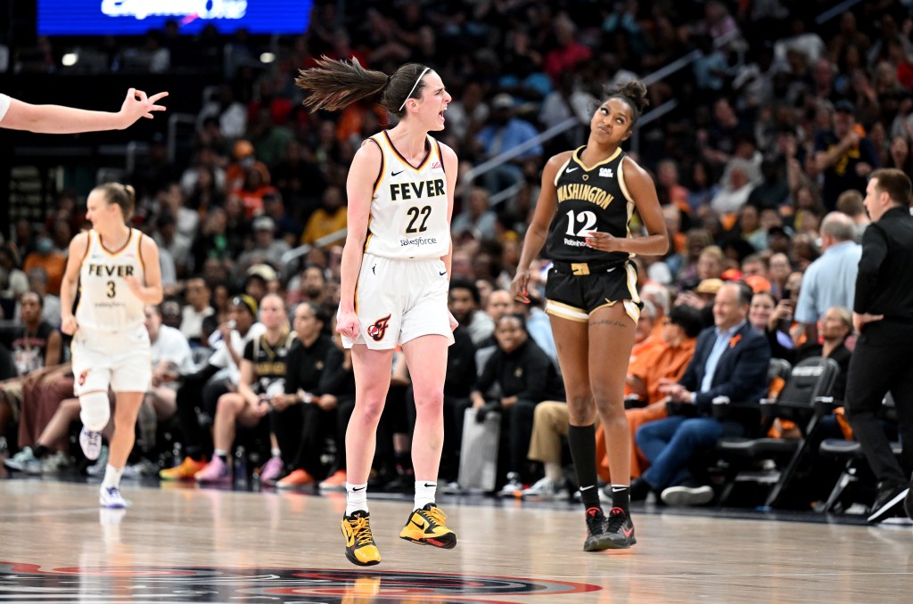 Caitlin Clark #22 of the Indiana Fever celebrates after scoring in the third quarter against the Washington Mystics