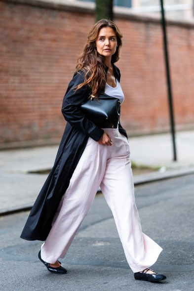 TRENCH THOROUGHFARE: Katie Holmes models herself after New York’s famous black and white cookie out in Soho.