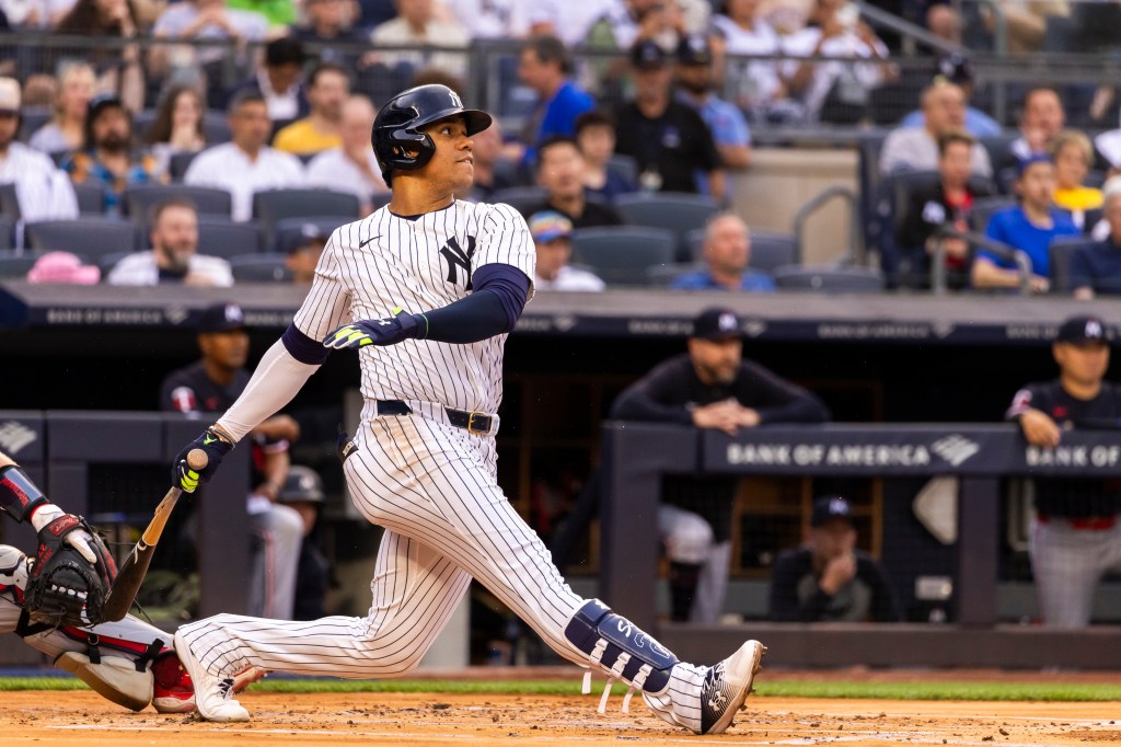 Yankees outfielder Juan Soto (22) hits a single during the first inning against the Minnesota Twins at Yankee Stadium Wednesday, June 5, 2024.