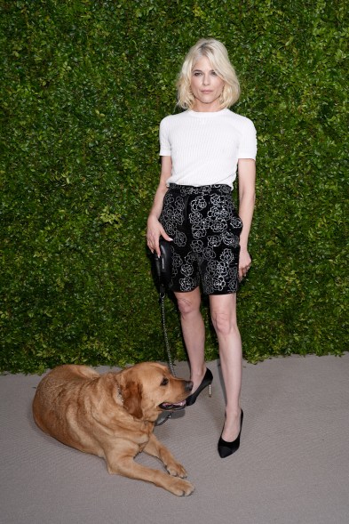 Selma Blair, wearing CHANEL, and her dog Scout attend the CHANEL Tribeca Festival Women's Lunch