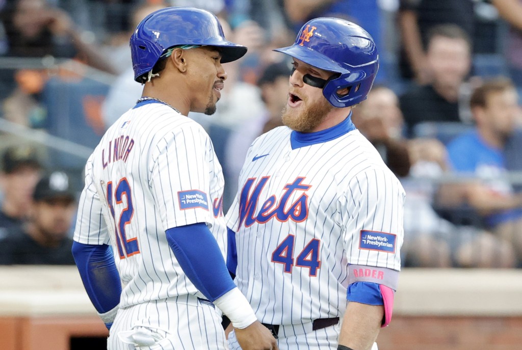 Harrison Bader (right) celebrates with Francisco Lindor after hitting a two-run homer in the first inning of the Mets' victory.