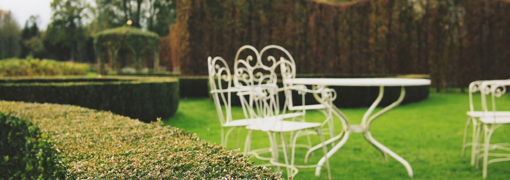 A white metal chair in a garden