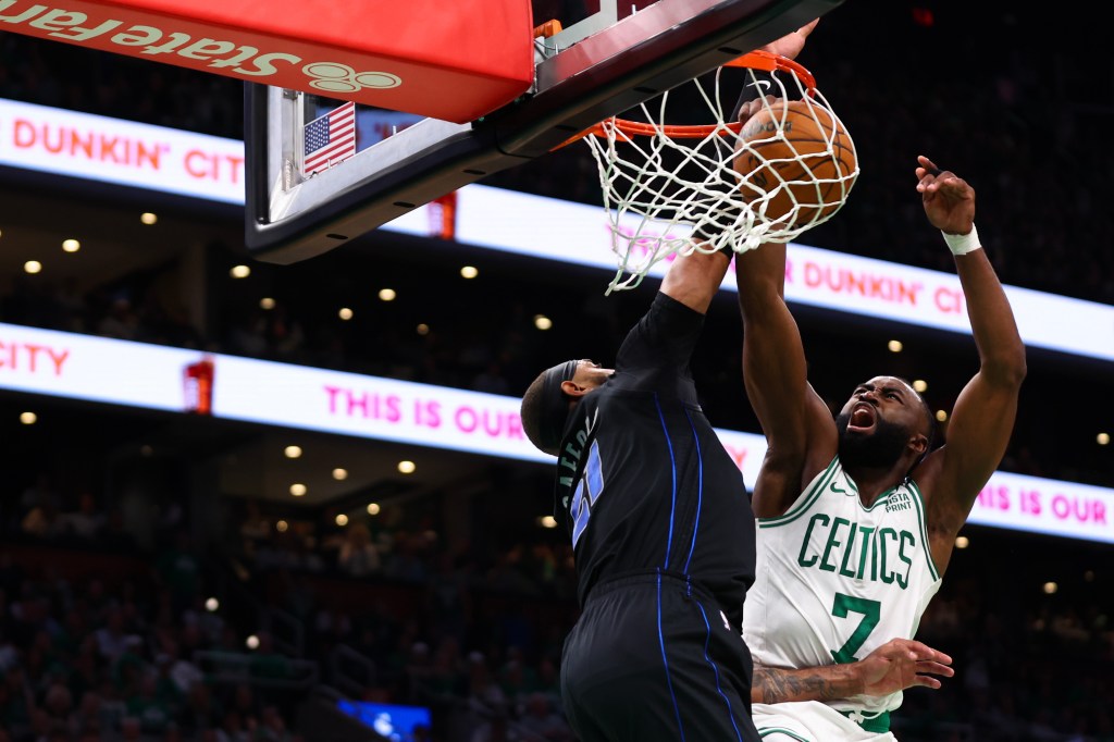 Jaylen Brown #7 of the Boston Celtics dunks the ball against Daniel Gafford #21 of the Dallas Mavericks during the second quarter in Game One of the 2024 NBA Finals at TD Garden on June 06, 2024 in Boston, Massachusetts. 