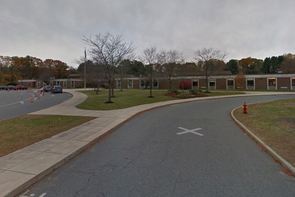 Exterior view of Margaret A. Neary Elementary School in Southborough with adjacent road and parking lot