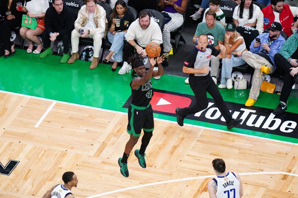 Boston Celtics guard Jrue Holiday (4) shoots against the Dallas Mavericks in the fourth quarter during game two of the 2024 NBA Finals at TD Garden.