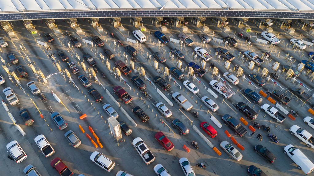 Two Americans were arrested at the the San Ysidro port of entry, in San Diego, after border patrol agents found an unconscious migrant in the back of their car.