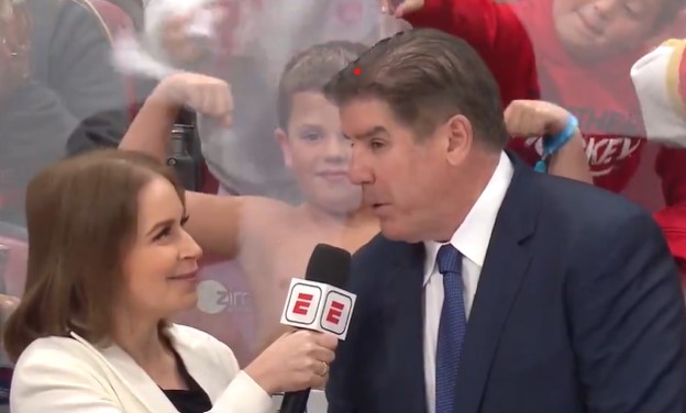 A young Florida Panthers fan flexes shirtless during Peter Laviolette's on-ice interview with ESPN during the first period of Game 6.